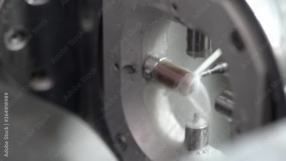 Closeup view at carving process in dental milling machine Closeup view at carving process in dental milling machine