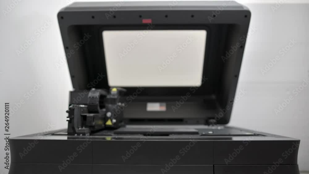 Closeup view at dental 3D printer in laboratory Closeup view at dental 3D printer in laboratory