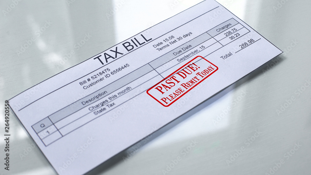 Fototapeta premium Past due seal stamped on tax bill, payment for services, month expenses, tariff