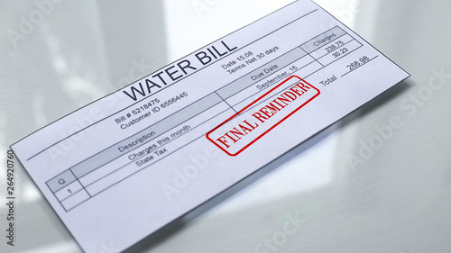 Final reminder seal stamped on water bill, payment for services, month expenses