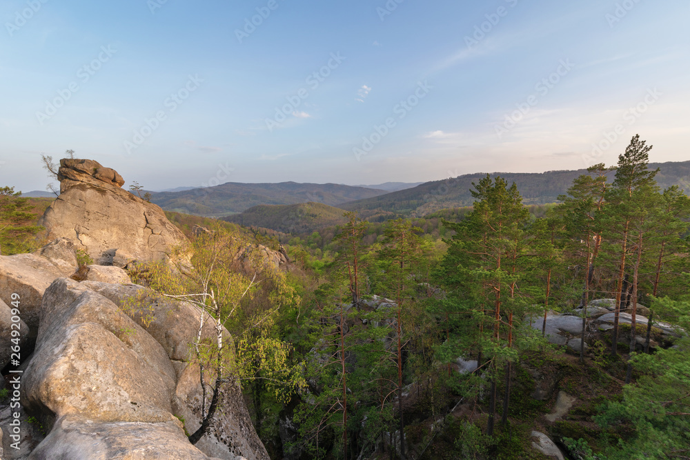 Warm weather is in the mountain forests of Ukrainian Carpathians on the rocks of the Dovbush