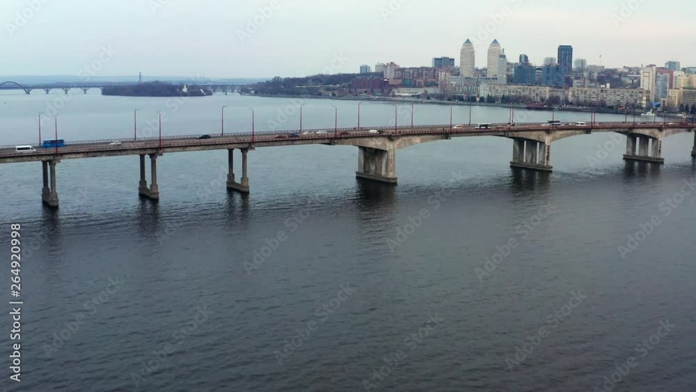 Cityscape with bridge with traffic through river Cityscape with bridge with traffic through river