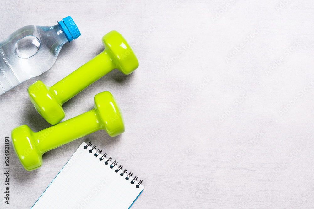 Dumbbells, water and towel top view. Dumbbells, water and towel top view.