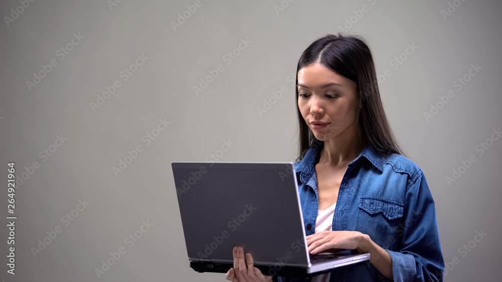 Concentrated freelancer working on computer, job for students, remote work Concentrated freelancer working on computer, job for students, remote work