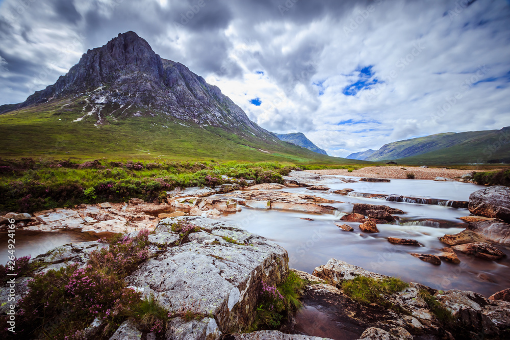 Beautiful river mountain landscape scenery in Glen Coe, Scottish Highlands, Scotland