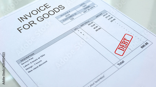 Debt seal stamped on invoice for goods document, business payment, crediting