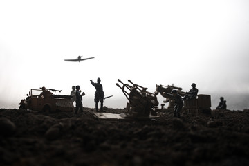 An anti-aircraft cannon and Military silhouettes fighting scene on war fog sky background. Allied air forces attacking on German positions. Artwork decorated scene.