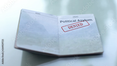 Fotografija Political asylum denied, seal stamped in passport, customs office, travelling