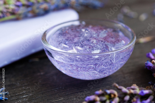 cleaning and skin care produst samples with lavender on black wooden