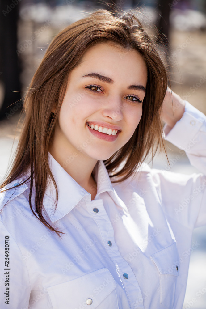 Close up. Young beautiful brunette girl in gray coat Close up. Young beautiful brunette girl in gray coat