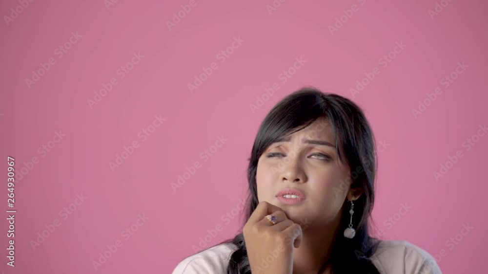asian woman thinking and looking up to copy space. thoughtful woman asian woman thinking and looking up to copy space. thoughtful woman