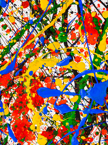 splashes on red and black and green and yellow and blue paint