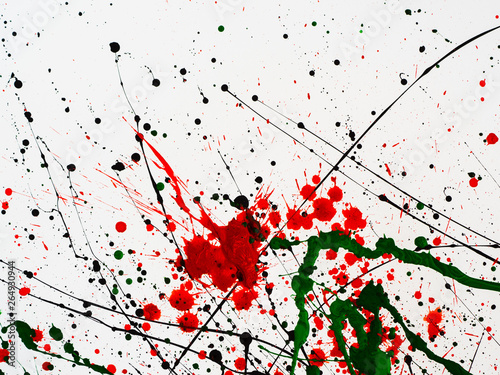 splashes on red and black and green paint photo