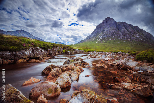 Beautiful river mountain landscape scenery in Glen Coe, Scottish Highlands, Scotland photo