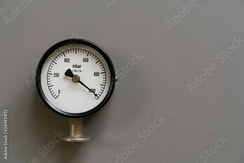 pressure gauge on gray background, engineering equipment concept