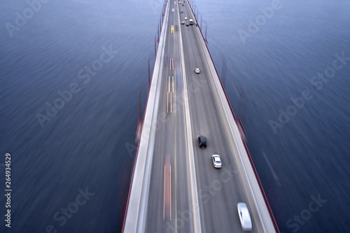 View at city bridge with traffic through river photo