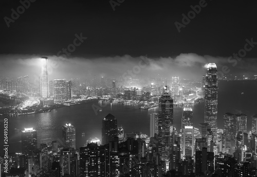 Misty night view of Victoria harbor in Hong Kong city © leeyiutung