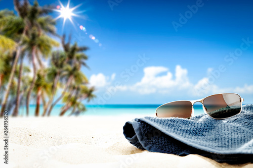 Summer sunglasses on beach and free space for your decoration. 