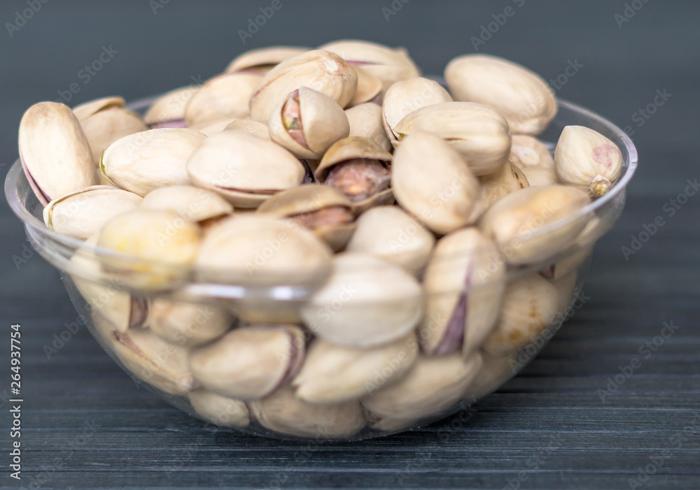 Healthy food for background image close up pistachios nuts. Texture on top view Nuts pistachio on the cup plate Healthy food for background image close up pistachios nuts. Texture on top view Nuts pistachio on the cup plate