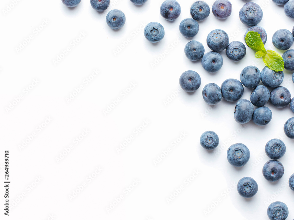 Blueberries isolated on white background. Blueberry border design. Ripe and juicy fresh picked bilberries close up. Copyspace. Top view or flat lay Blueberries isolated on white background. Blueberry border design. Ripe and juicy fresh picked bilberries close up. Copyspace. Top view or flat lay