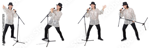 Young man singing with microphone isolated on white 