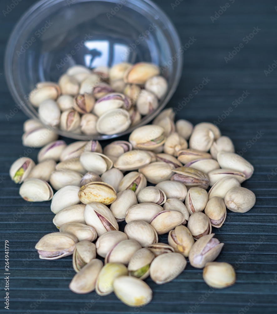 Healthy food  for background image close up pistachios nuts. Texture on top view Nuts pistachio on the cup plate