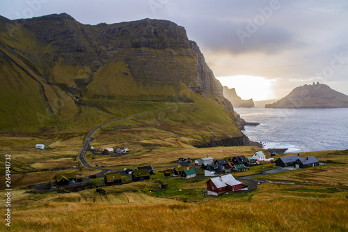 View of Gasadalur village in Vegas Island,Faroe Islands.Beautiful traditional village on coast under mountains with typical nordic Scandinavian houses.Tourist popular attraction/destination in Denmark © Dajahof