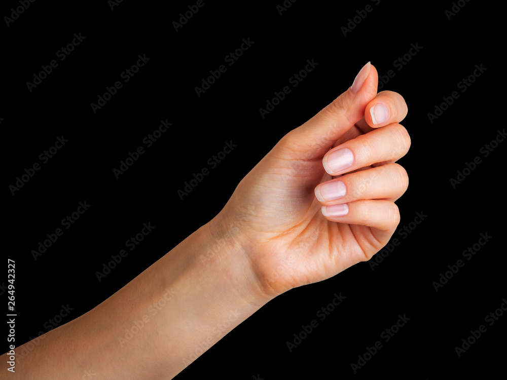Woman hand holding something with two fingers Woman hand holding something with two fingers