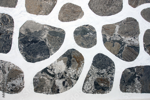 Fototapeta Naklejka Na Ścianę i Meble -  The texture traditional stones rock Greek floor