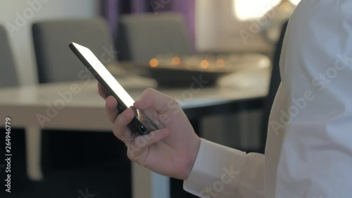 businessman typing sms mms on a smartphone photo
