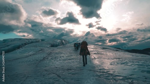 Young girl doing a glacier hike in Iceland at Vatnajokull National Park photo