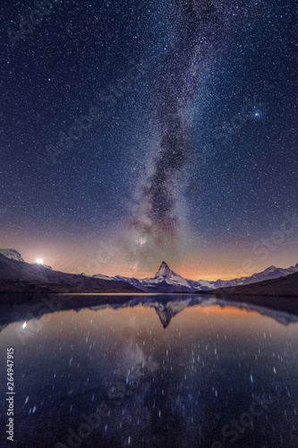 Milky way at lake Stellisee Matterhorn , Zermatt , Switzerland.