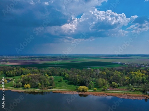 landscape with lake and clouds in Minsk Region of Belarus