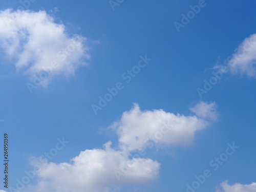 The vast blue sky with soft white clouds. Abstract white and blue background.