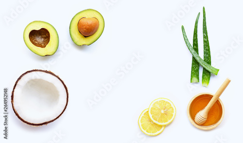 Natural ingredients for homemade skin care on white background.