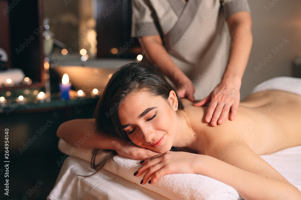 Spa, massage. Young dark-haired beautiful girl doing massage. Spa, massage. Young dark-haired beautiful girl doing massage.