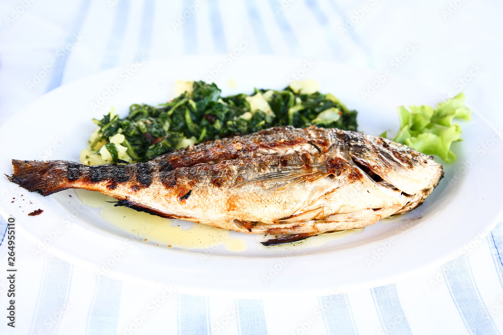 grilled fish with cooked vegetables grilled fish with cooked vegetables