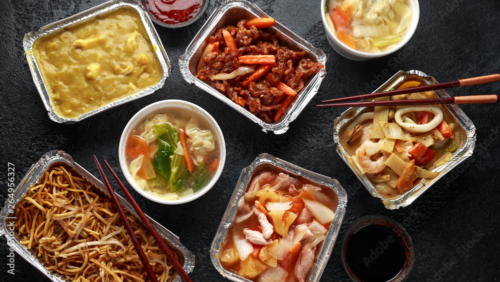 Chinese takeaway food. Pork Wonton dumpling soup, Crispy shredded beef, sweet and sour pineapple chicken, egg noodles with bean sprouts, curry. Chinese takeaway food. Pork Wonton dumpling soup, Crispy shredded beef, sweet and sour pineapple chicken, egg noodles with bean sprouts, curry.
