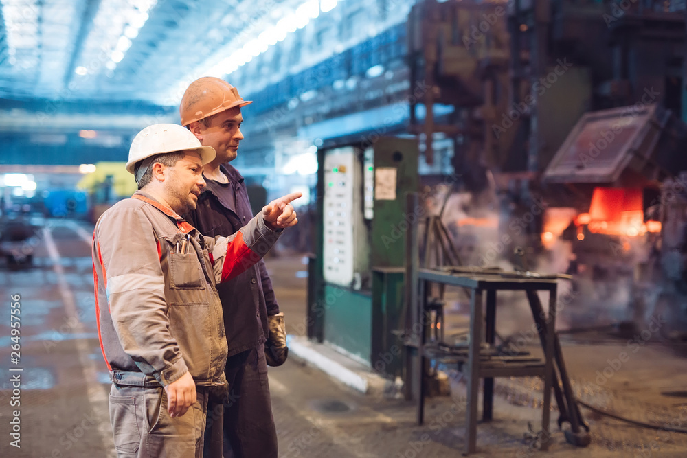 Workers in the steel mill. Workers in the steel mill.