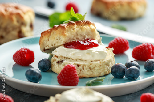 Classic English scones with clotted cream  strawberries jam and other fruit