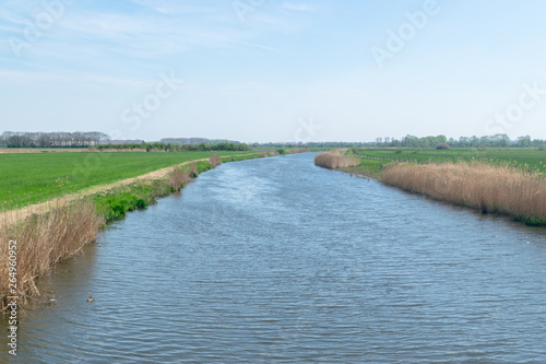Dutch river through meadows
