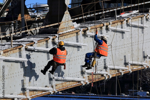 Workers perform work at high altitude over the Moscow River