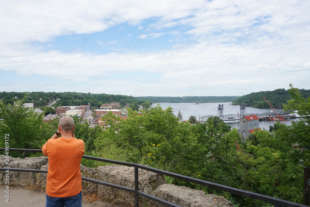 Fototapeta premium A man standing on a overlook in Still Water, Minnesota.
