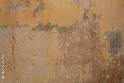 Old Damaged Concrete Dark Yellow Painted Wall