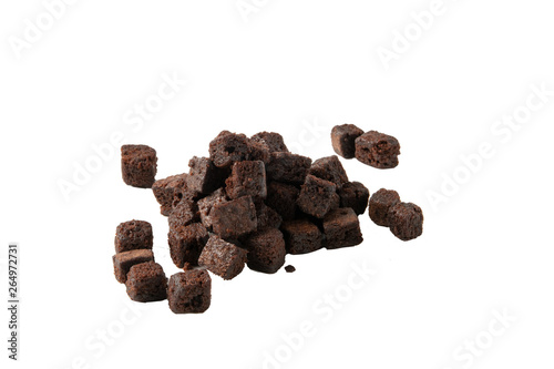 Chocolate brownie pieces isolated on white background