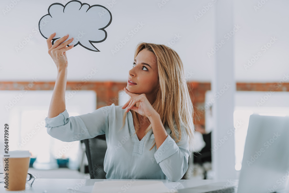 Curious woman putting thought cloud near her head Curious woman putting thought cloud near her head