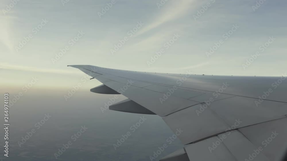 plane wing flying in the sky, shadow outside plane window plane wing flying in the sky, shadow outside plane window