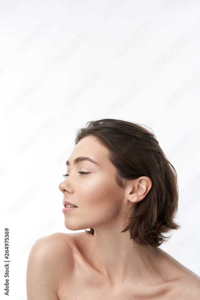 Side face of pretty brunette female on white Side face of pretty brunette female on white