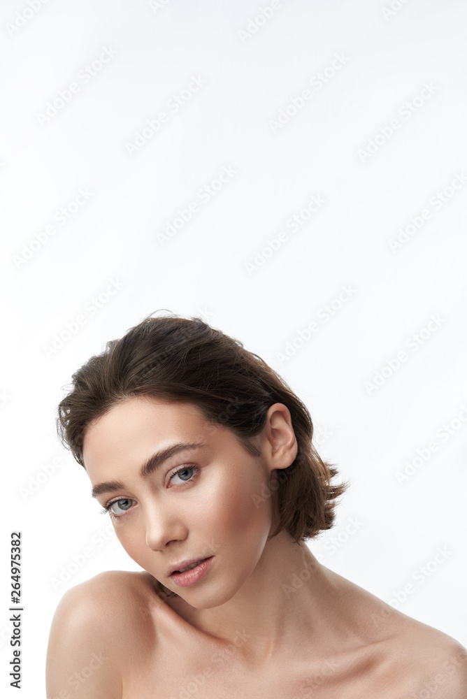 Young sensual pretty brunette female on white Young sensual pretty brunette female on white