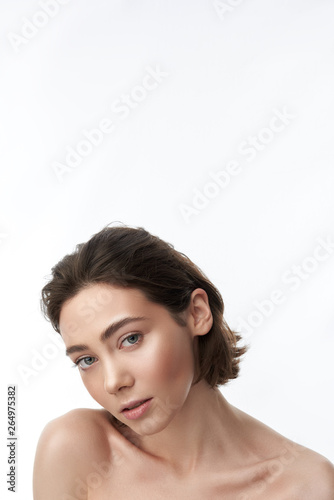 Young sensual pretty brunette female on white